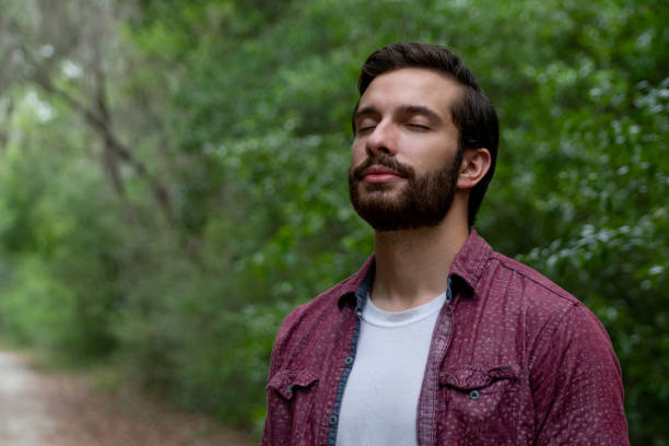 istock Young man breathing fresh air 1219079429