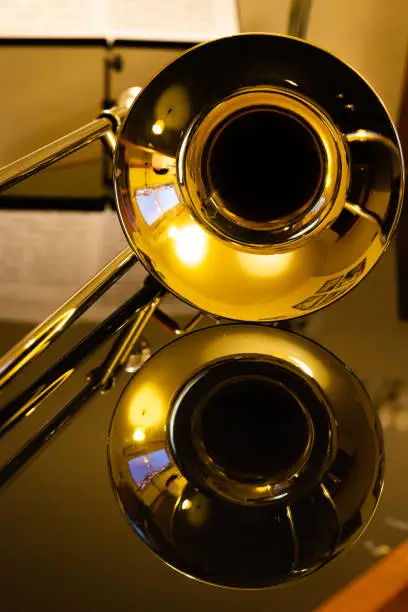 closeup of tenor trombone on the dark table