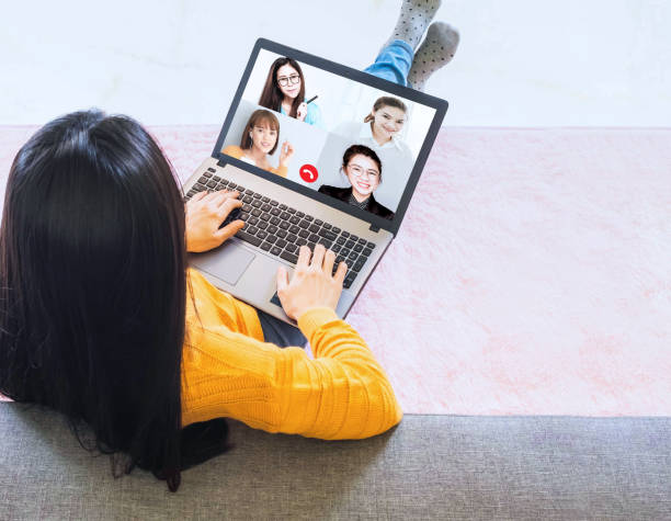 istock Laptop screen view over business woman talking about work,sitting by sofa make video call have distant communication using videoconference app working from home to prevent corona virus 1219081446