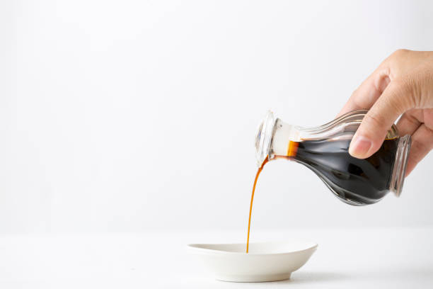 Pouring soy sauce Pouring soy sauce soy sauce photos stock pictures, royalty-free photos & images