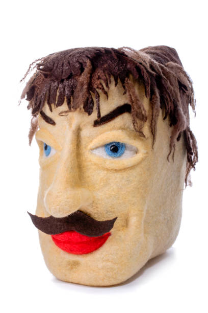istock Felted pillow in the shape of a male head 1219086582