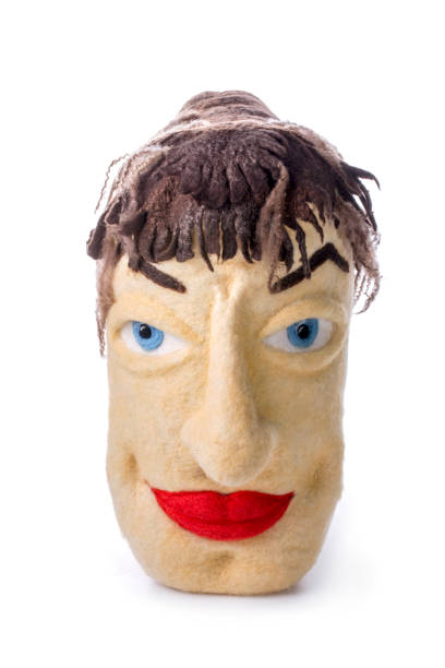 istock Felted pillow in the shape of a male head 1219086583