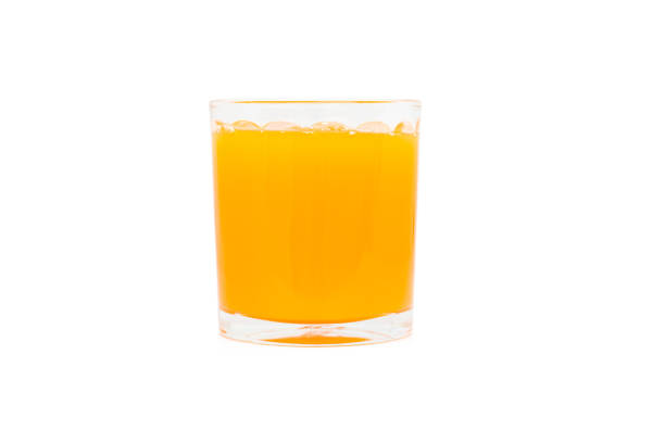 istock Orange juice glass, isolated on white background 1219087479