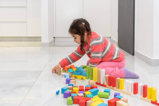 istock Zero waste. Child play with plastic free wooden toys 1219087648
