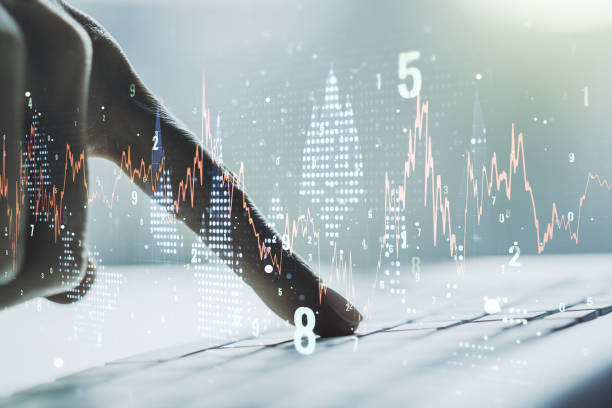 istock Multi exposure of abstract financial graph with hand typing on laptop on background, financial and trading concept 1219088331