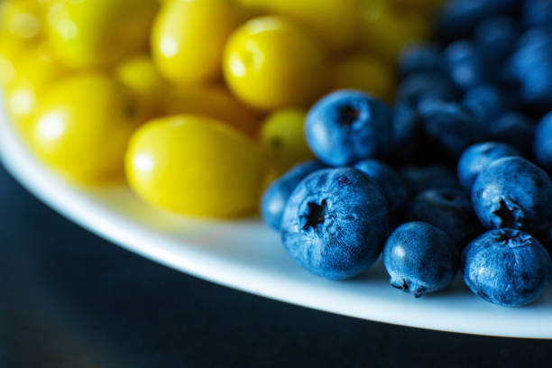 Mix of yellow and blue berries. Summer mick fruit. Berry layout