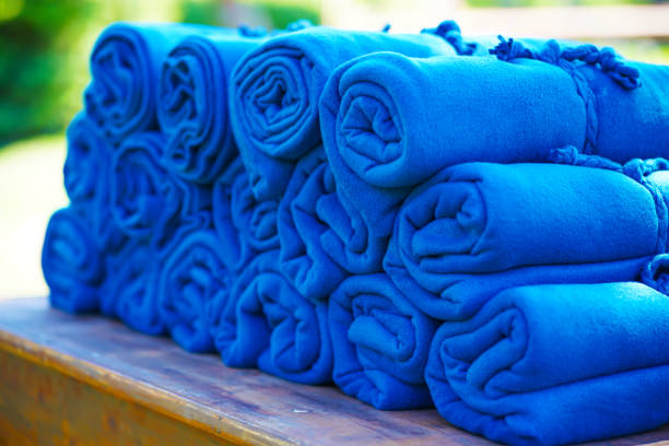 A set of warm blue rugs at an open-air party, in case guests feel cold in the evening A set of warm blue rugs at an open-air party, in case guests feel cold in the evening. fleece photos stock pictures, royalty-free photos & images