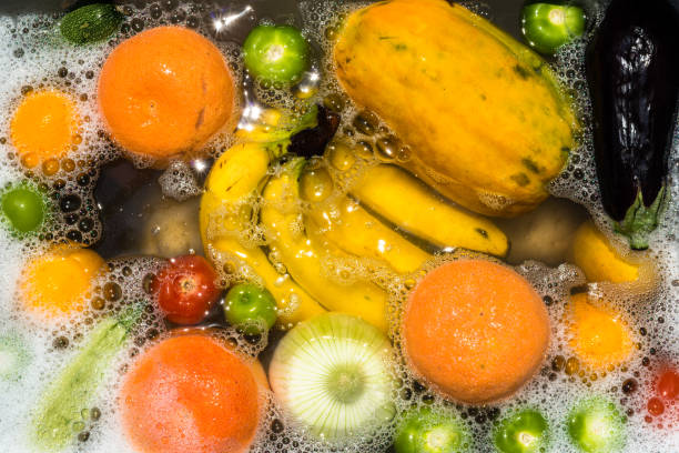 Fruit and vegetables washing for coronavirus disinfection. stock photo