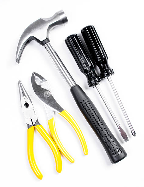 istock Hammer and Pliers with Screwdrivers Isolated on White 121909611