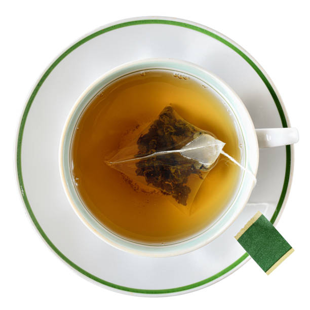 istock Cup with a bag of black tea top view isolated 1219098111