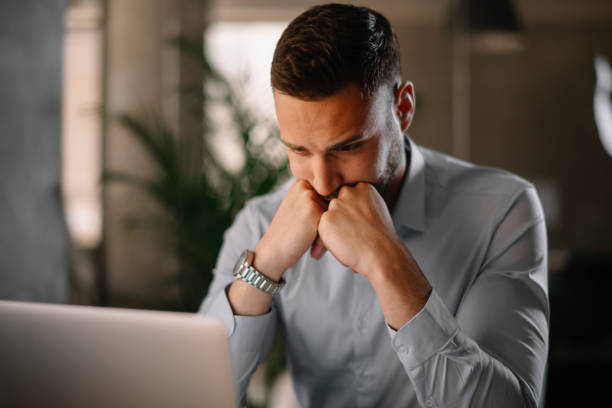 istock Young businessman working in office. 1219100213