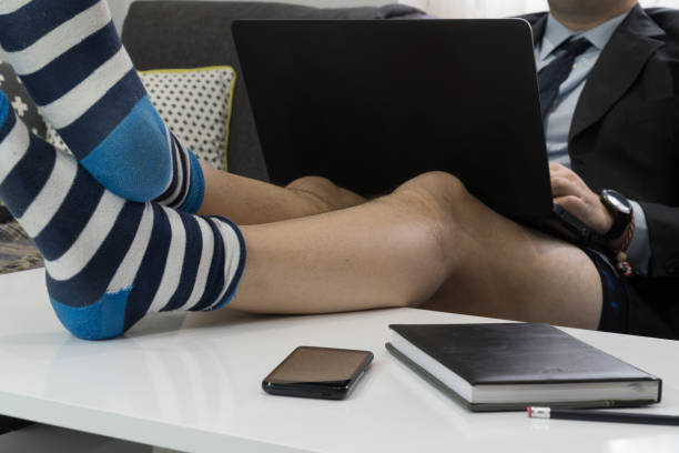 istock Home office concept - businessman working on a laptop in his underware 1219100263