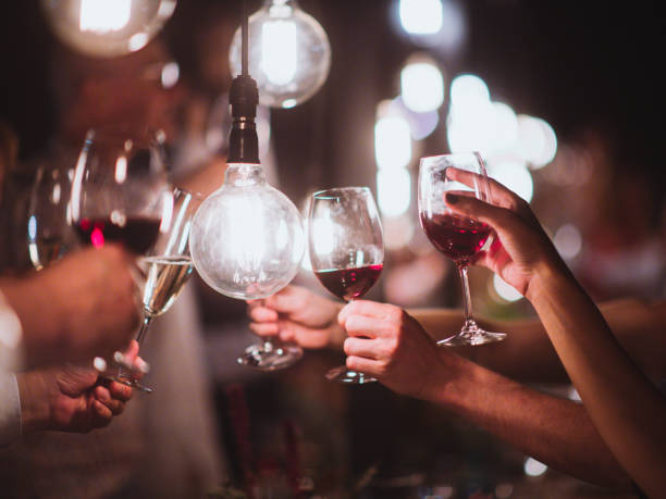 istock Light Bulb Celebratory Toast multiple people 1219101167