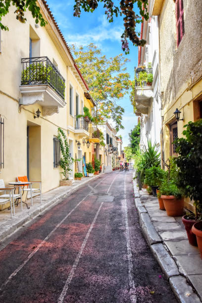 ancient district of Athens - Plaka The streets of the ancient district of Athens - Plaka, the narrow old streets, shutters, many green plants athens greece photos stock pictures, royalty-free photos & images
