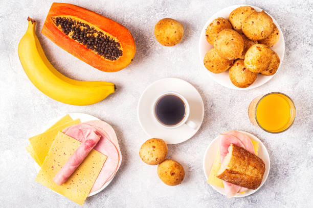 istock Traditional Brazilian breakfast - cheese bread, coffee, ripe fruit, top view 1219105012
