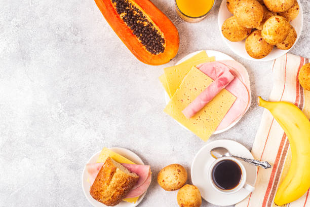 istock Traditional Brazilian breakfast - cheese bread, coffee, ripe fruit, top view 1219105023