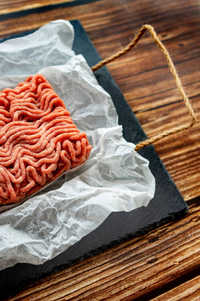 istock minced meat on cooking paper and stone tray 1219105575