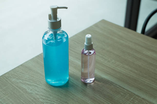 Alcohol gel Sanitizer hand gel cleaners for anti virus , People using alcohol gel to wash hands to prevent COVID-19 virus and Coronavirus stock photo