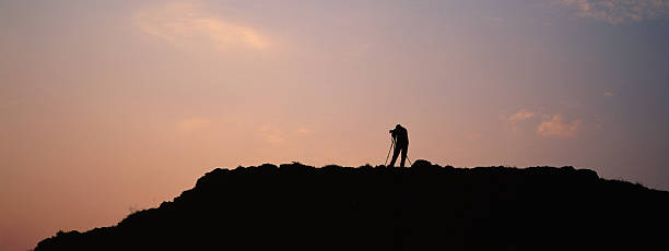 istock Photographer on Mountain Silhouette 121910652