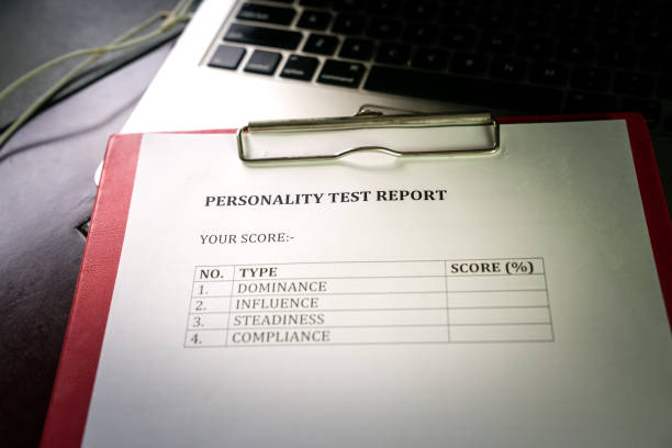 Personality test report. On top of computer laptop. Personality test report. On clipboard. Human Resource, career or Job Interview concept. personality test stock pictures, royalty-free photos & images