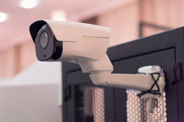 istock Security CCTV camera or surveillance system in office building, Intelligent cameras can record video all day and night to keep you safe from thieves. Surveillance camera Anti-theft system concept. 1219111313