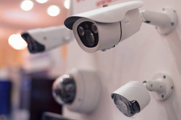 istock Security CCTV camera or surveillance system in office building, Intelligent cameras can record video all day and night to keep you safe from thieves. Surveillance camera Anti-theft system concept. 1219111465