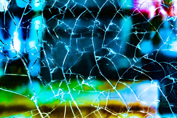 shattered glass. the glass texture cracked and the backlight cracked. mirror, broken background. abstract crack pattern. - mirror broken mosaic mirrored pattern imagens e fotografias de stock