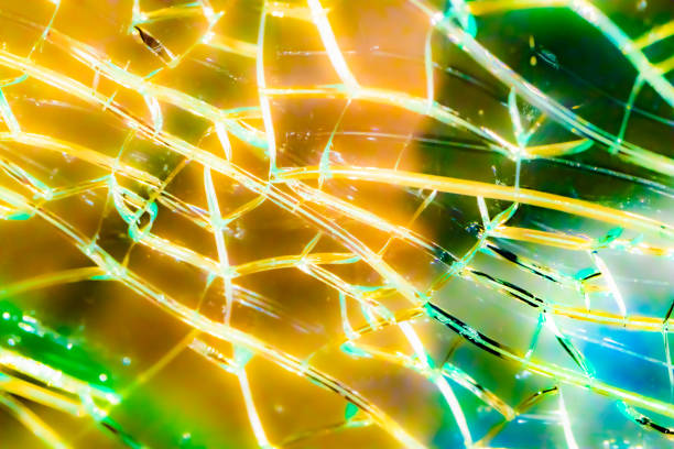 shattered glass. the glass texture cracked and the backlight cracked. mirror, broken background. abstract crack pattern. - mirror broken mosaic mirrored pattern imagens e fotografias de stock