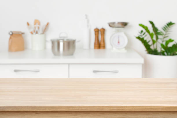 istock Table background of free space on blurred kitchen counter interior 1219113743