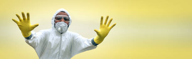 istock Man in protection suit prohibiting entry 1219115028