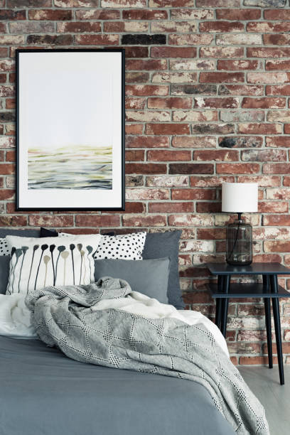 istock Red brick wall in bedroom 1219115580