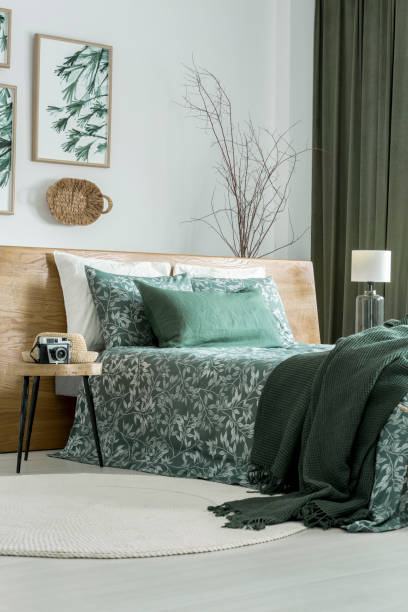 Floral poster in green bedroom