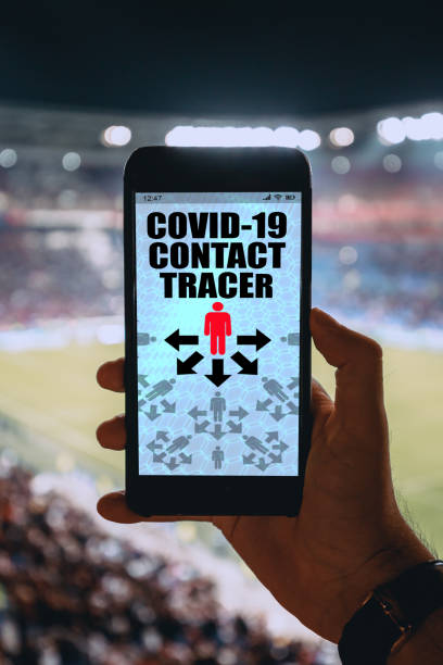 istock Covid-19 app on smartphone software in crowd of people with bluetooth notification 1219117065