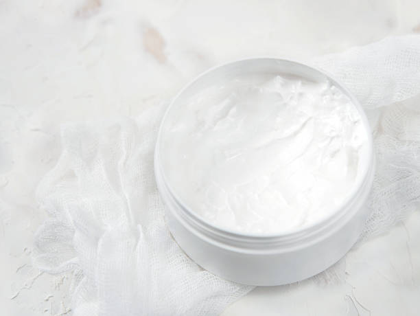 istock White medical cream in a jar on a white background 1219117587