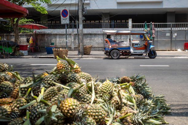 istock Pineapple and Tuk Tuk 1219118634