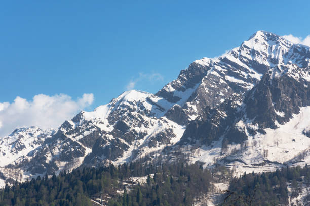 istock Beautiful snow-capped mountains against the blue sky 1219120687