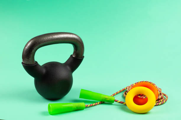 istock Sport equipment on green background. 1219120928