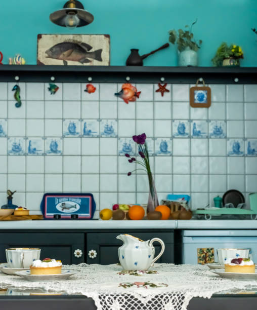 istock Cups, saucers, cakes on the table with a tablecloth. 1219122888