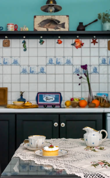 istock Cups, saucers, cakes on the table with a tablecloth. 1219122896