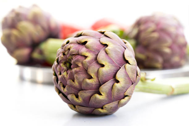 Fresh artichoke on white background.