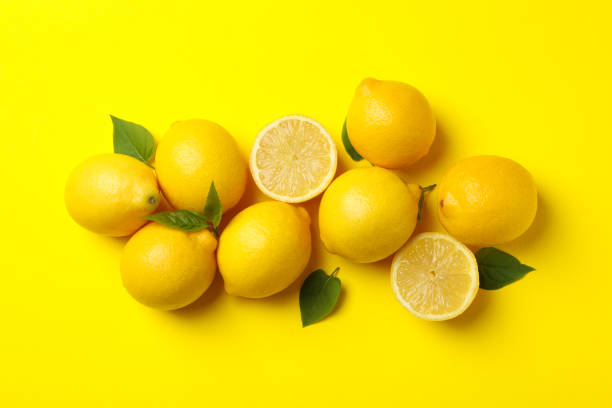 istock Lemons on yellow background, top view. Fresh fruit 1219123836