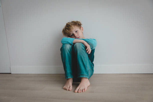 istock boy feeling anxiety and stress, kid staying home 1219124172
