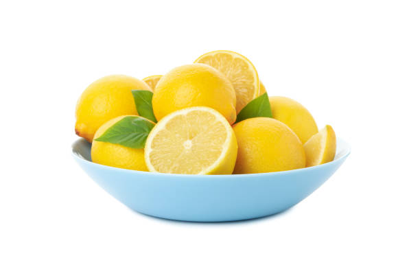 istock Plate with fresh lemons isolated on white background 1219125635