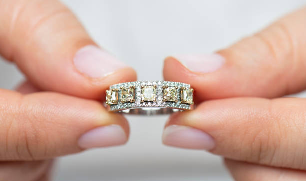 istock Woman Holding A Diamond Ring 1219125780
