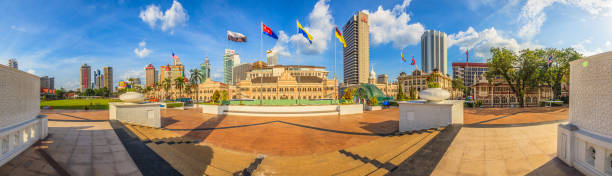 View from Merdeka Square in Kuala Lumpur Photo taken from Merdeka Square in Kuala Lumpur overlooking the skyline and the ancient Sultan Abdul Samad Building photographed in Malaysia in November 2013 merdeka square stock pictures, royalty-free photos & images
