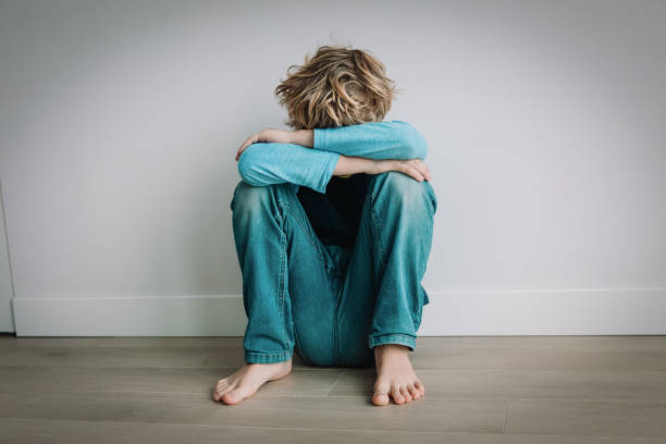 istock boy feeling anxiety and stress, kid staying home 1219126916