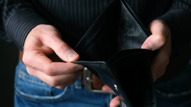 Empty Wallet In Male Businessman Hands Empty Wallet In Male Businessman Hands. Bankruptcy Concept, Financial Crisis, No Money belt leather isolated close up stock pictures, royalty-free photos & images