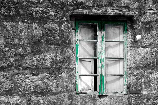 istock Old window closed in traditional stone house 1219127085