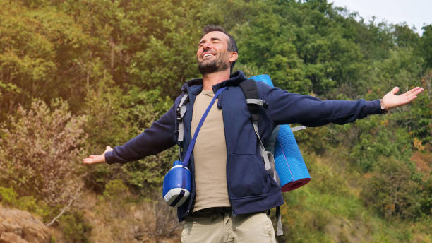 istock Portrait of a guy exploring the mountain while traveling. 1219127198