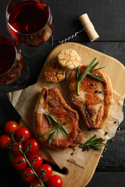 istock Composition with fried steaks and wine. Grilled food 1219128566